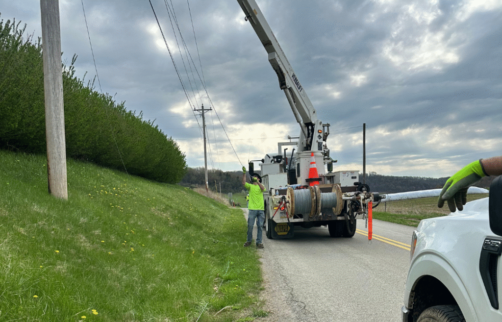 Fiber crew setting up strand line on a rural job site