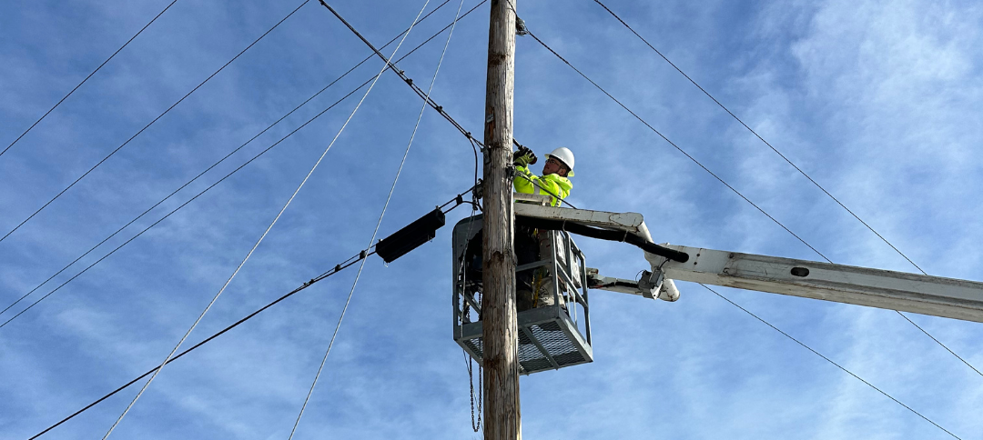 Aerial fiber installation on utility pole for broadband project
