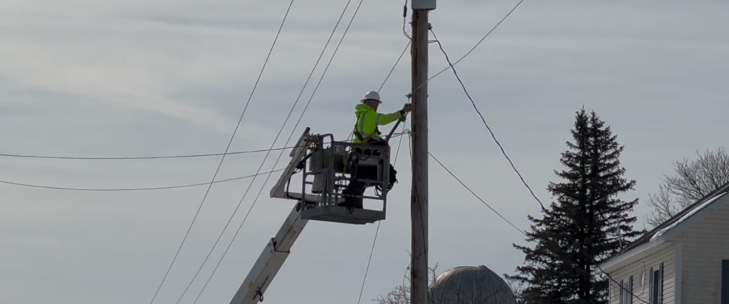 Fiber splicer working on network reliability in the field.