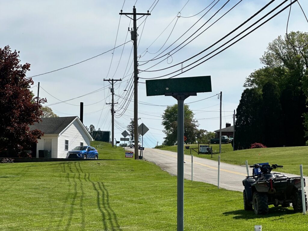 Technicians performing manual fiber installation survey without drone technology