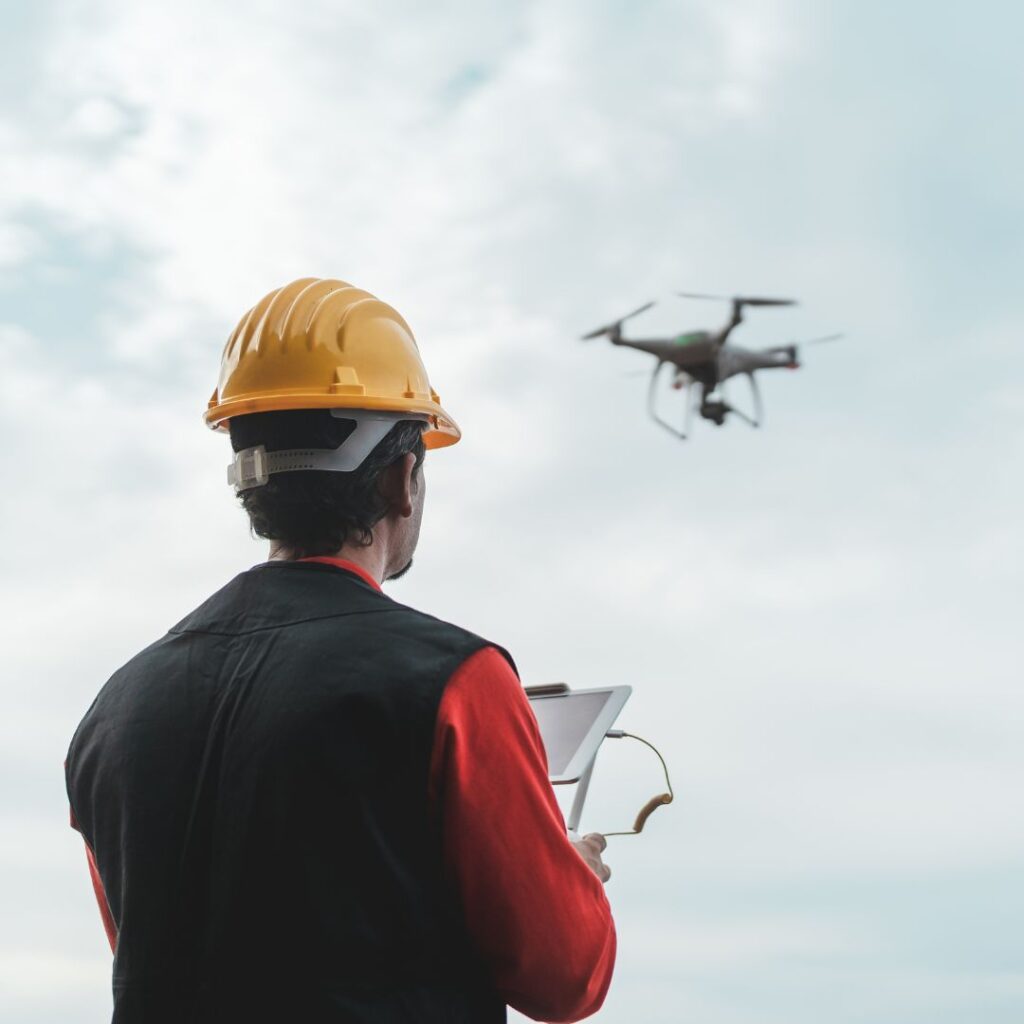 Project manager using drone technology data to monitor fiber installation progress