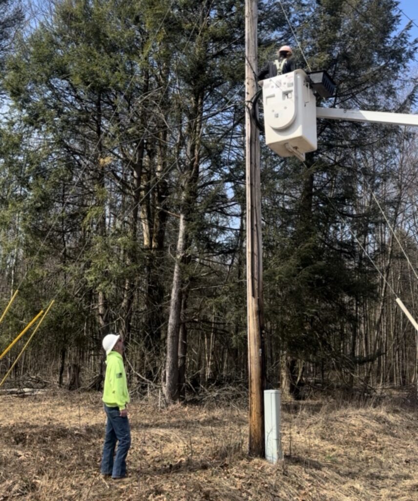Fiber workers watching out for each other on an elevated job site.